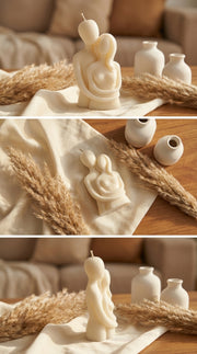 Decorative candles shaped like a heart and a rabbit on a wooden surface with decorative elements.
