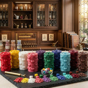 Colorful candles on a black tray with a wooden cabinet in the background